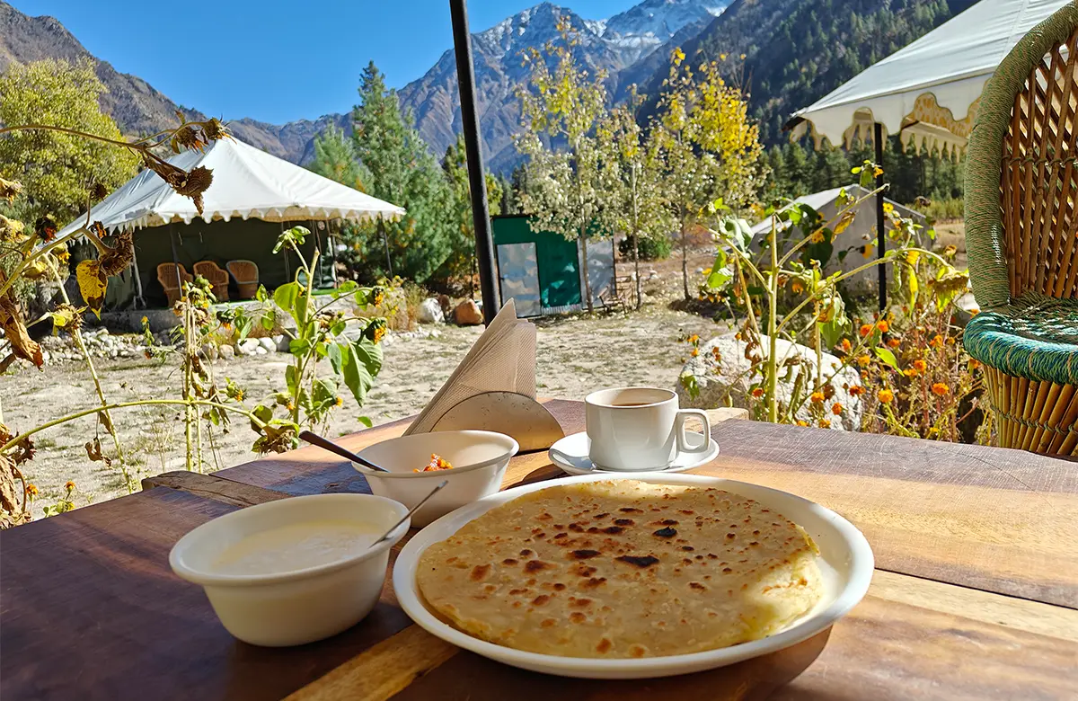 delicious-aloo-paranthas-serviced-with-pickle-curd-and-tea-in-chitkul